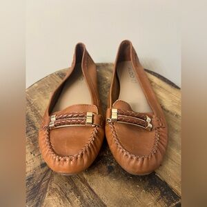 ALDO brown leather loafers with a gold-tone buckle and braided detail.